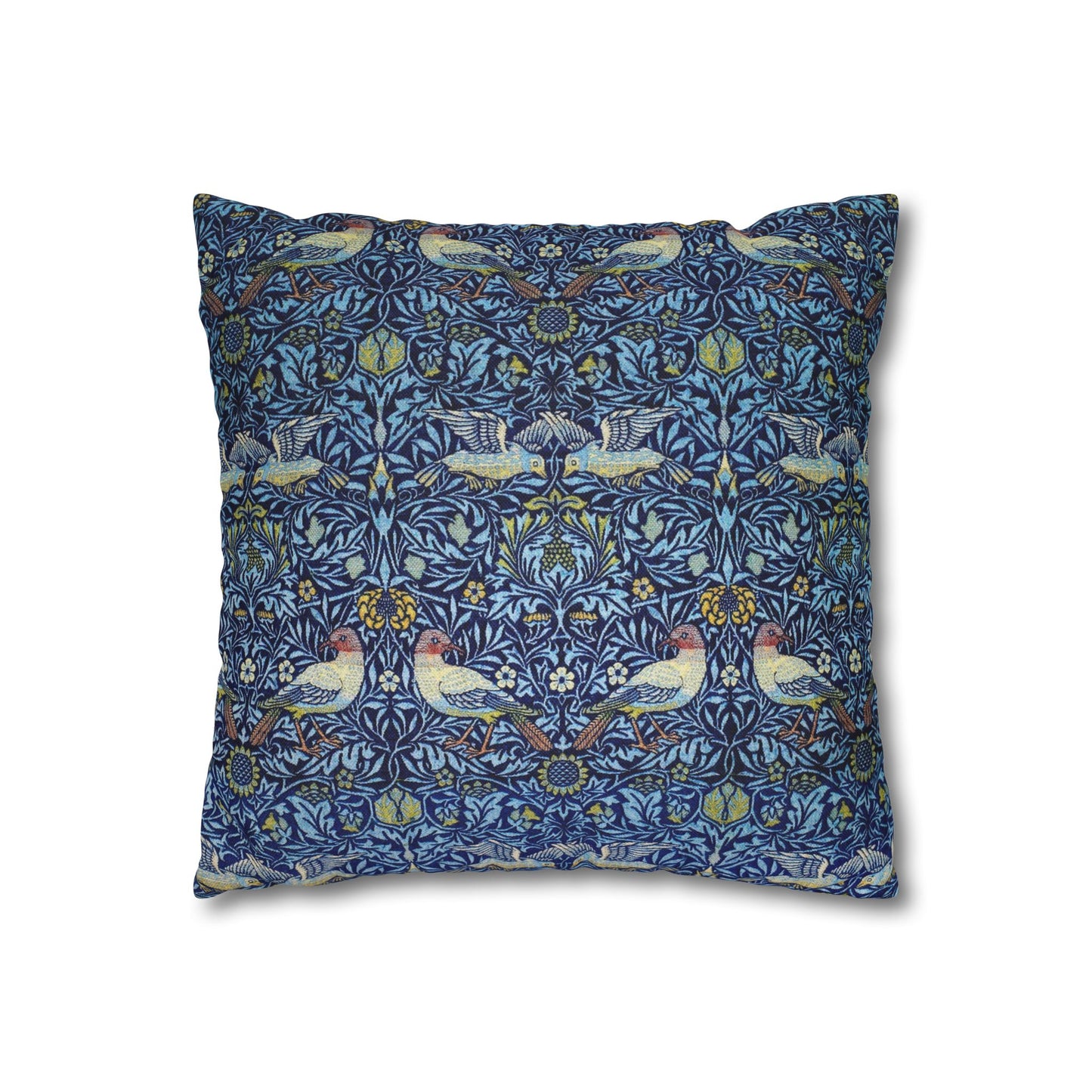 Decorative pillow with a blue pattern featuring birds and floral elements on a white background