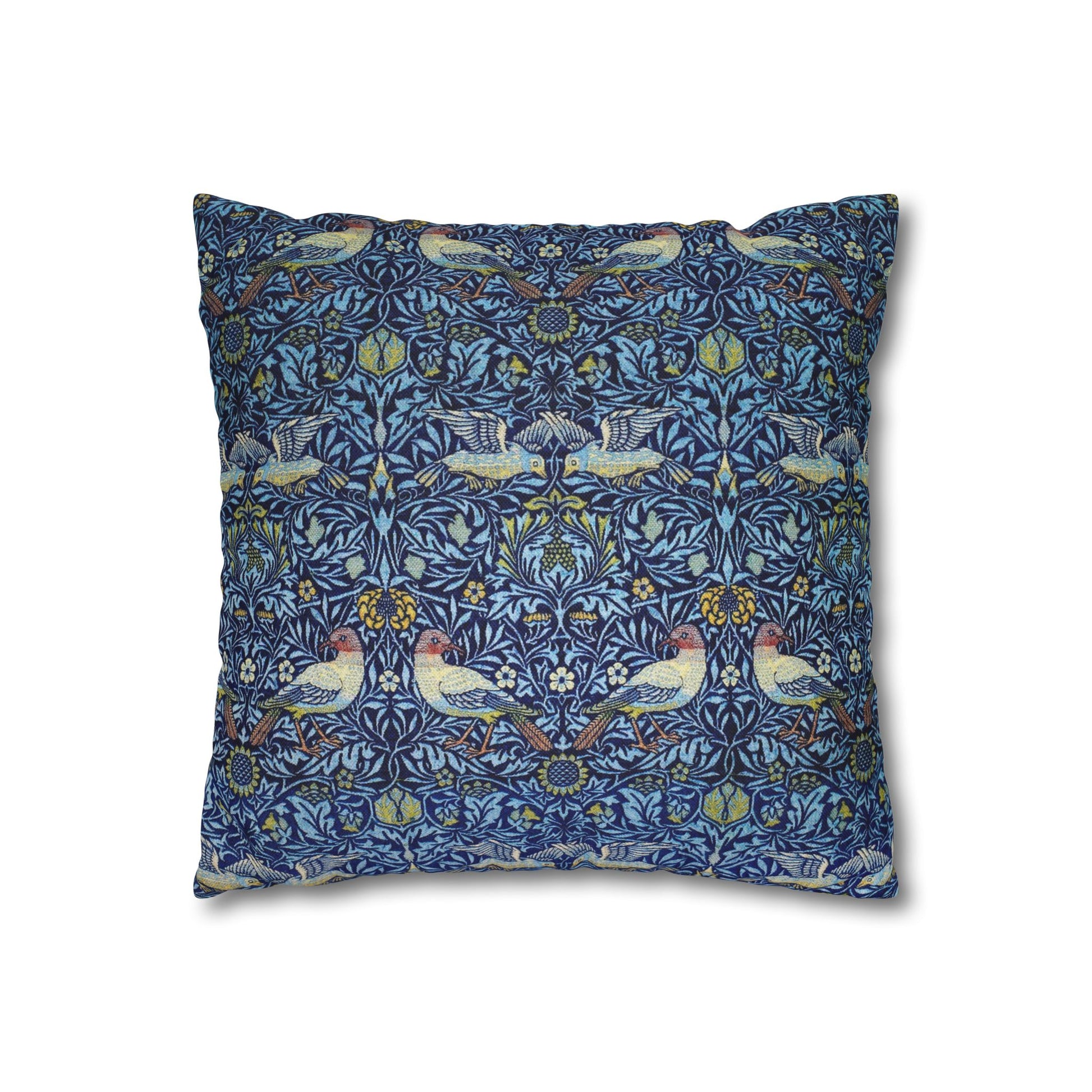 Decorative pillow with a blue pattern featuring birds and floral elements on a white background