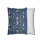 Two pillows, one with a blue floral pattern and the other with a white and gray striped pattern, on a white background.