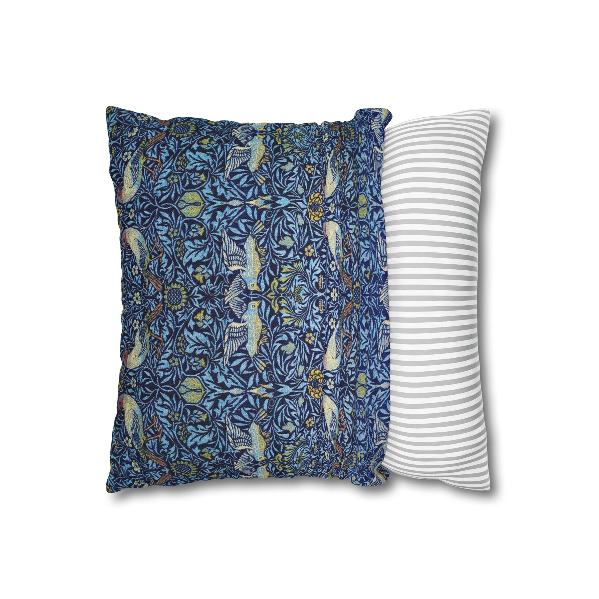 Two pillows, one with a blue floral pattern and the other with a white and gray striped pattern, on a white background.