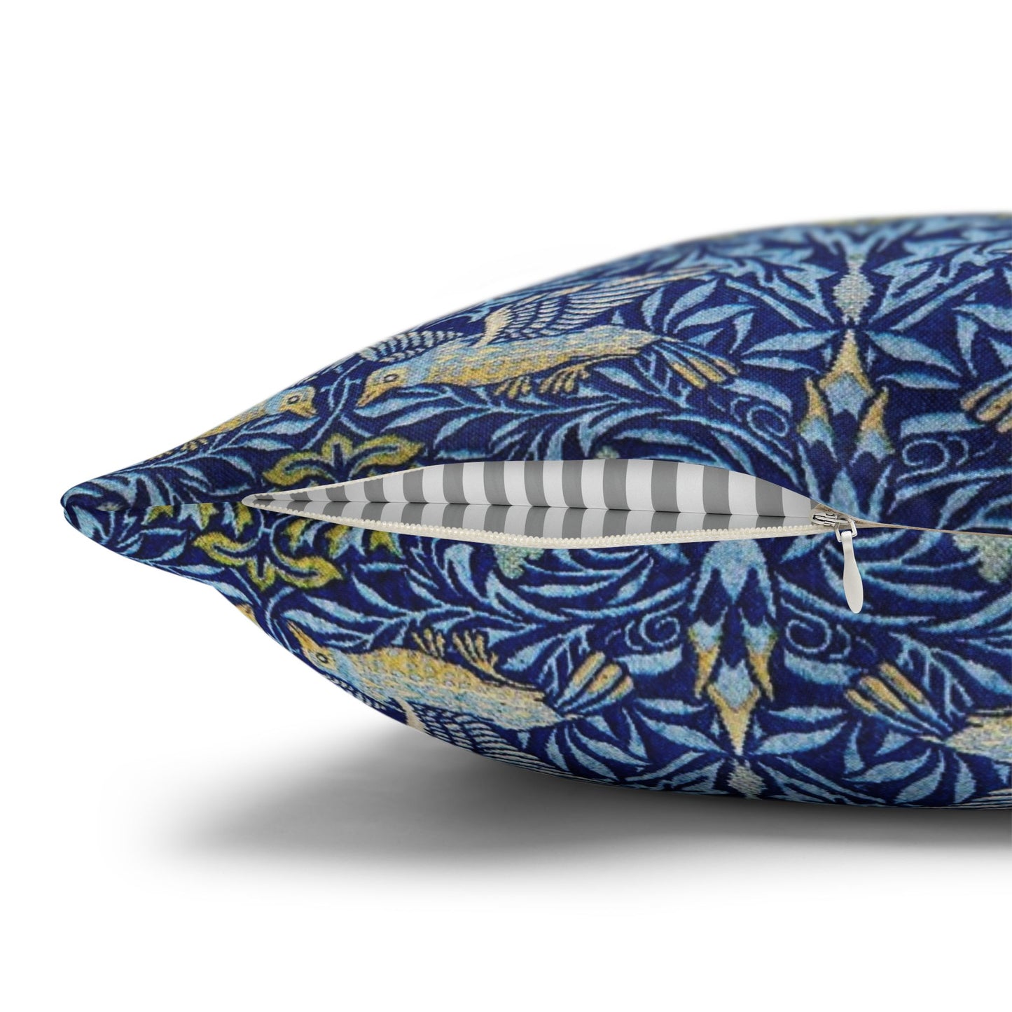 Decorative pillow with blue and yellow pattern on a white background