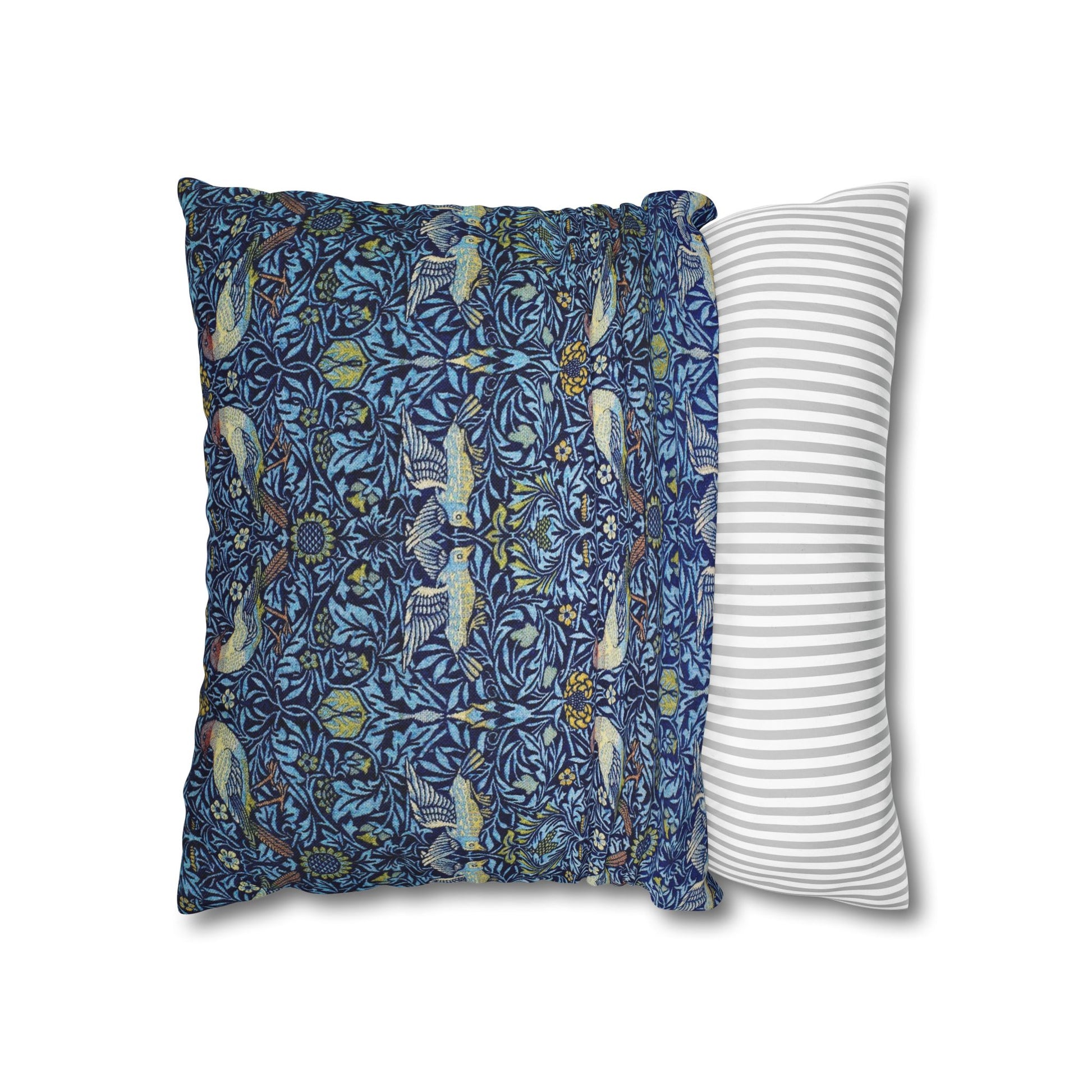 Two pillows, one with a blue floral pattern and the other with a white and gray striped pattern, on a white background.