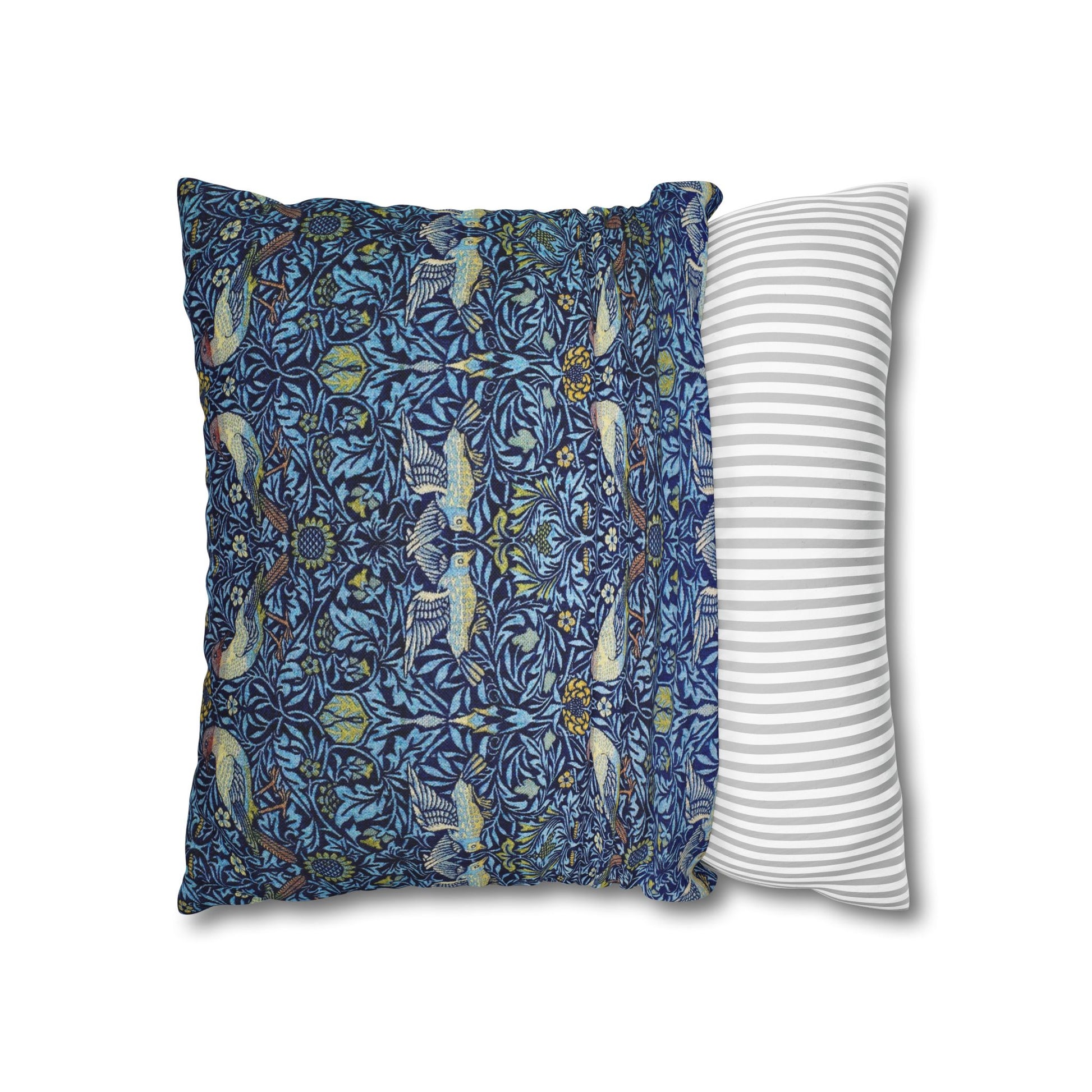 Two pillows, one with a blue floral pattern and the other with a white stripe design, on a white background.