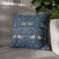 Decorative pillow with bird pattern on a gray sofa