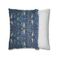 Two pillows, one with a blue floral pattern and the other with a white and gray striped pattern, on a white background.