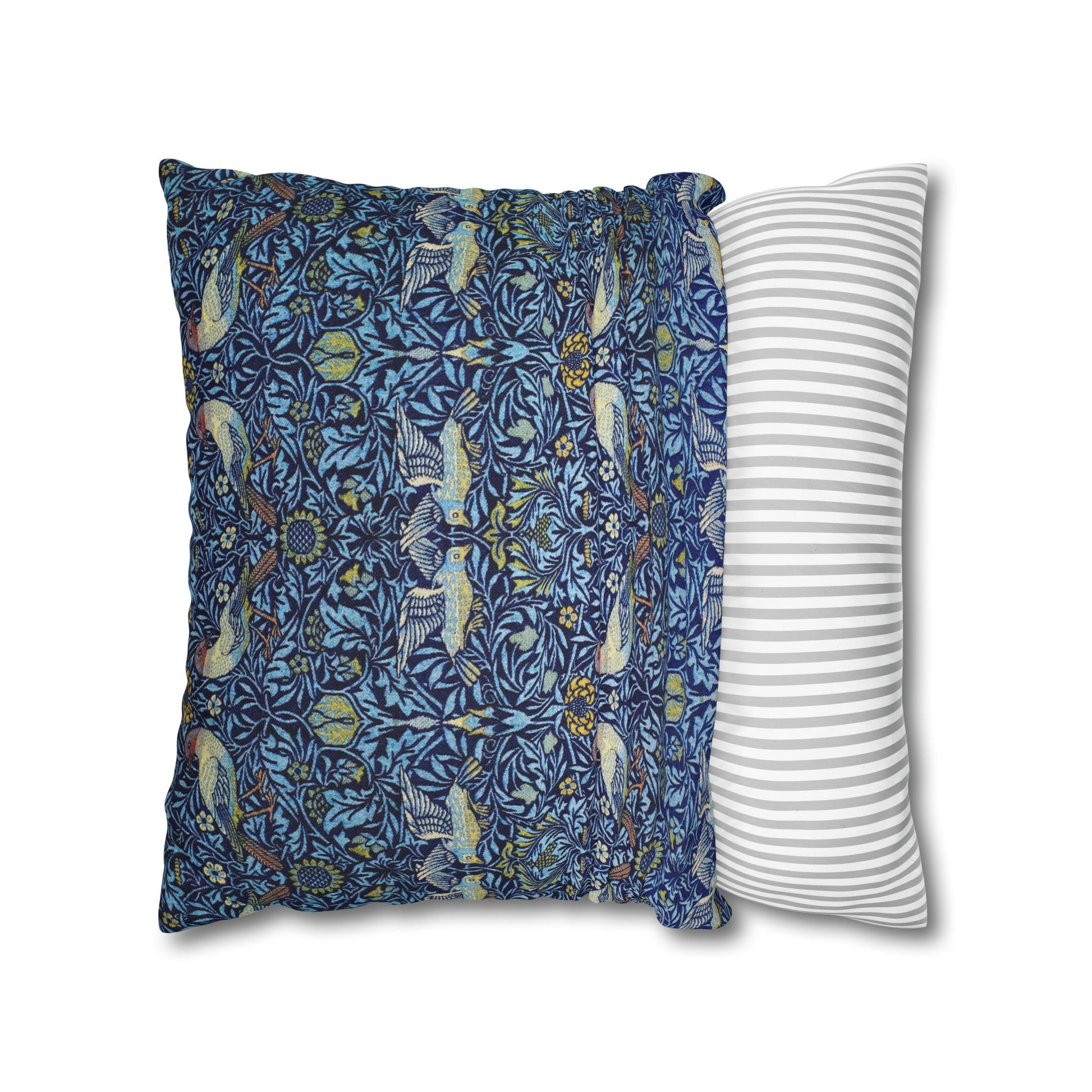 Two pillows, one with a blue floral pattern and the other with a white and gray striped pattern, on a white background.