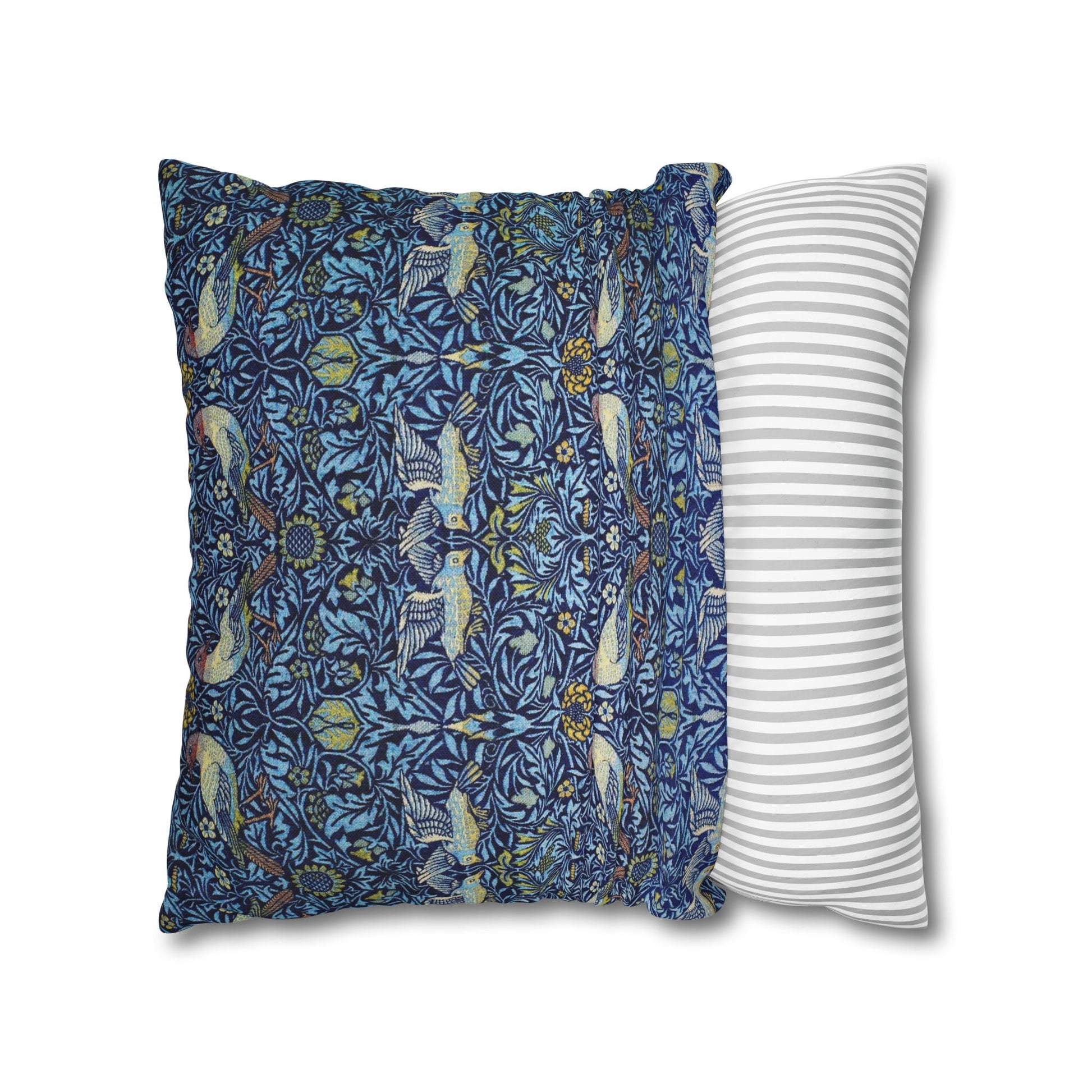 Two pillows, one with a blue floral pattern and the other with a white and gray striped pattern, on a white background.
