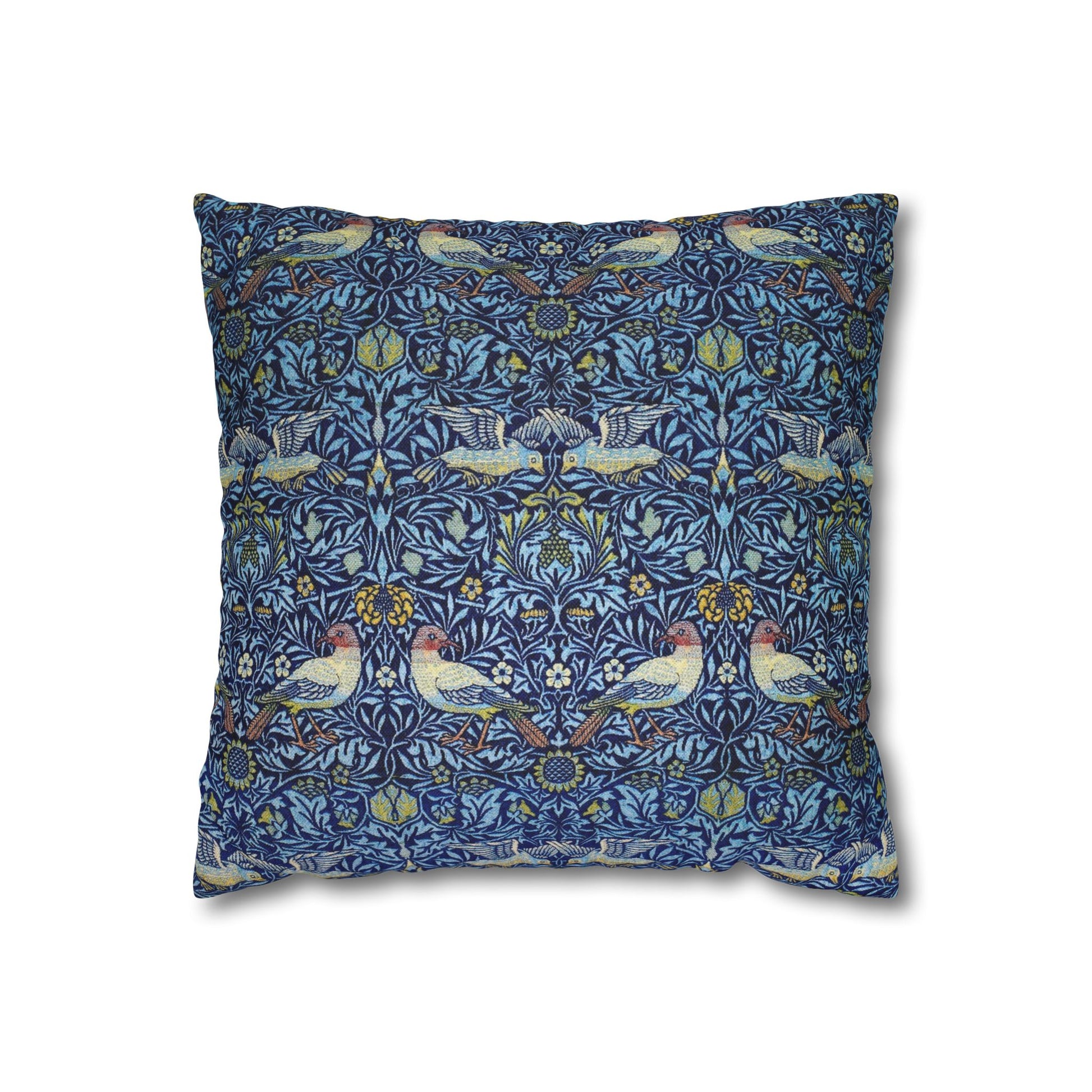 Decorative pillow with a blue pattern featuring birds and floral elements on a white background