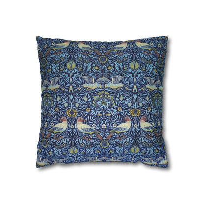 Decorative pillow with a blue pattern featuring birds and floral elements on a white background