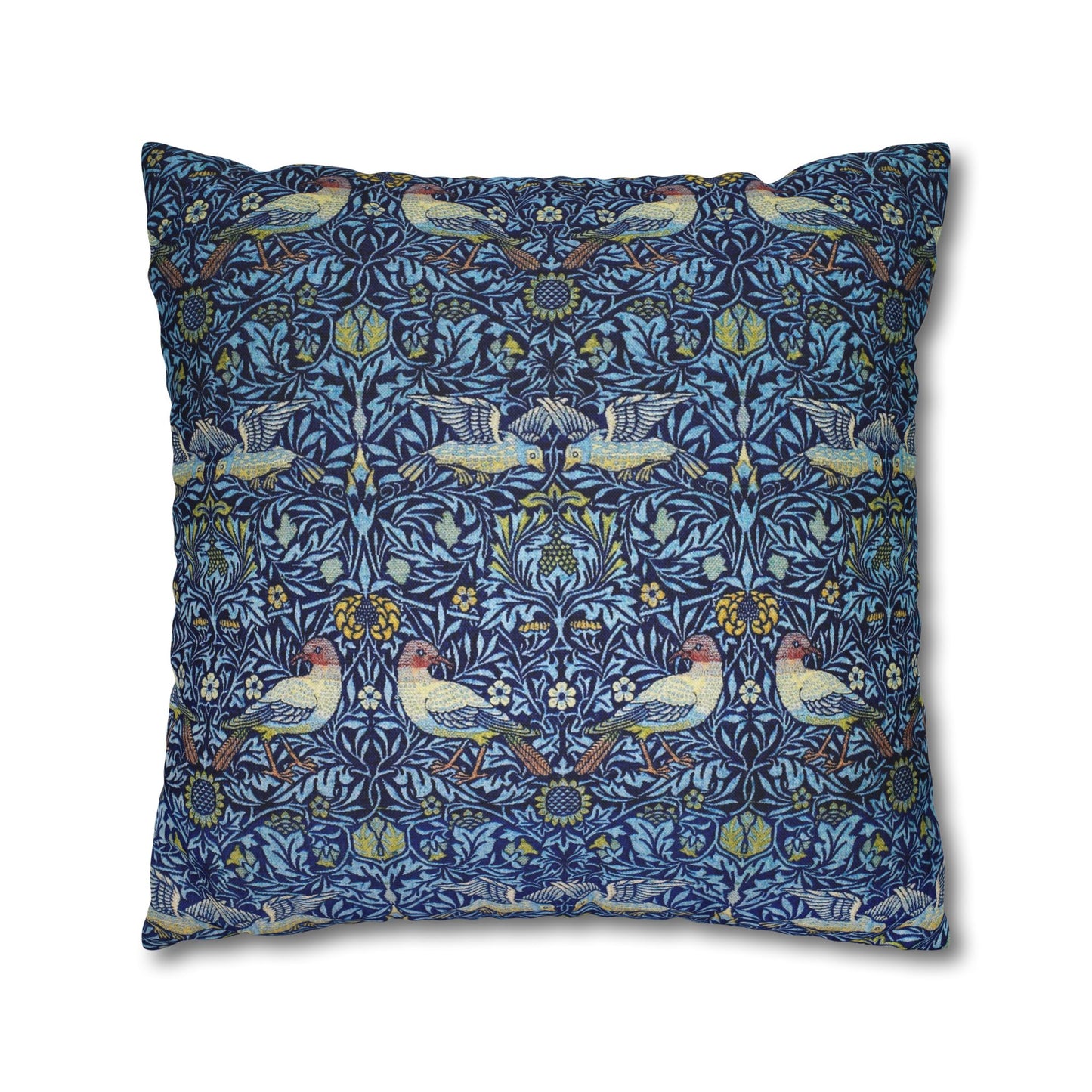 Decorative pillow with a blue pattern featuring birds and flowers on a white background
