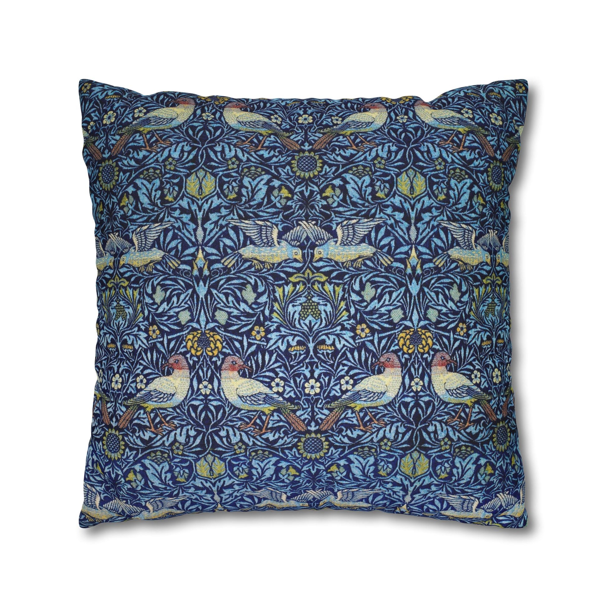 Decorative pillow with a blue pattern featuring birds and flowers on a white background