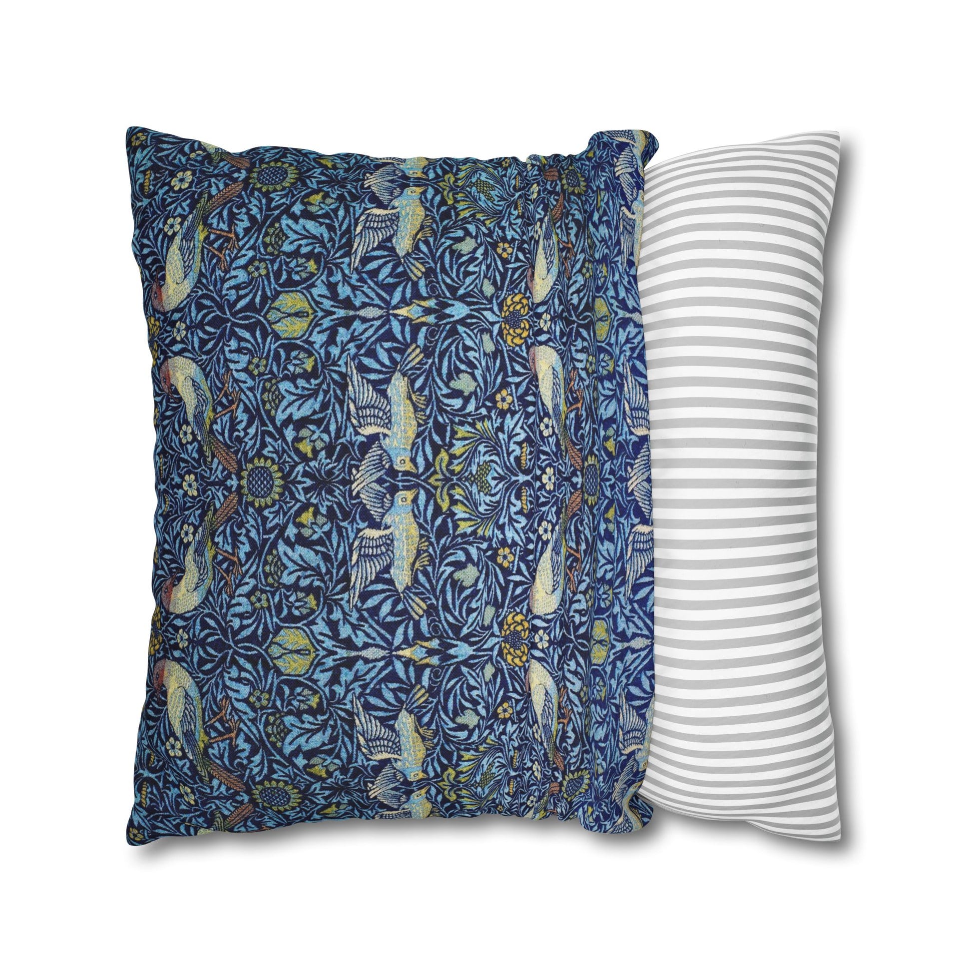 Two pillows, one with a blue floral pattern and the other with a white and gray striped pattern, on a white background.