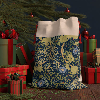 A rectangular linen Christmas gift bag with a blue floral pattern and a polyester drawstring.