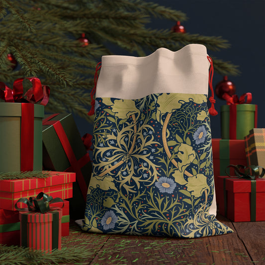 A rectangular linen Christmas gift bag with a blue floral pattern and a polyester drawstring.