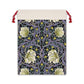 A rectangular Christmas-themed linen drawstring bag with a floral pattern, primarily in purple and green colours, and a red drawstring at the top.