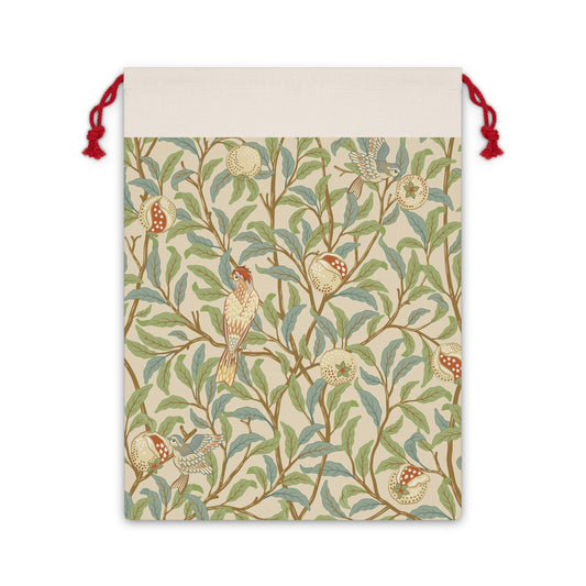 A Christmas Santa sack with a parchment colour, featuring a bird and pomegranate design inspired by William Morris & Co.