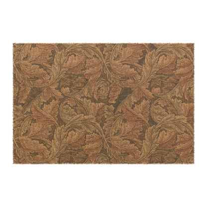 A rectangular coconut coir doormat with an intricate brown leaf William Morris & Co pattern and a solid black vinyl backing, designed for indoor and outdoor use.