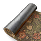 A rectangular coconut coir doormat with a floral pattern inspired by William Morris's designs, featuring a green background with multi-coloured flowers.