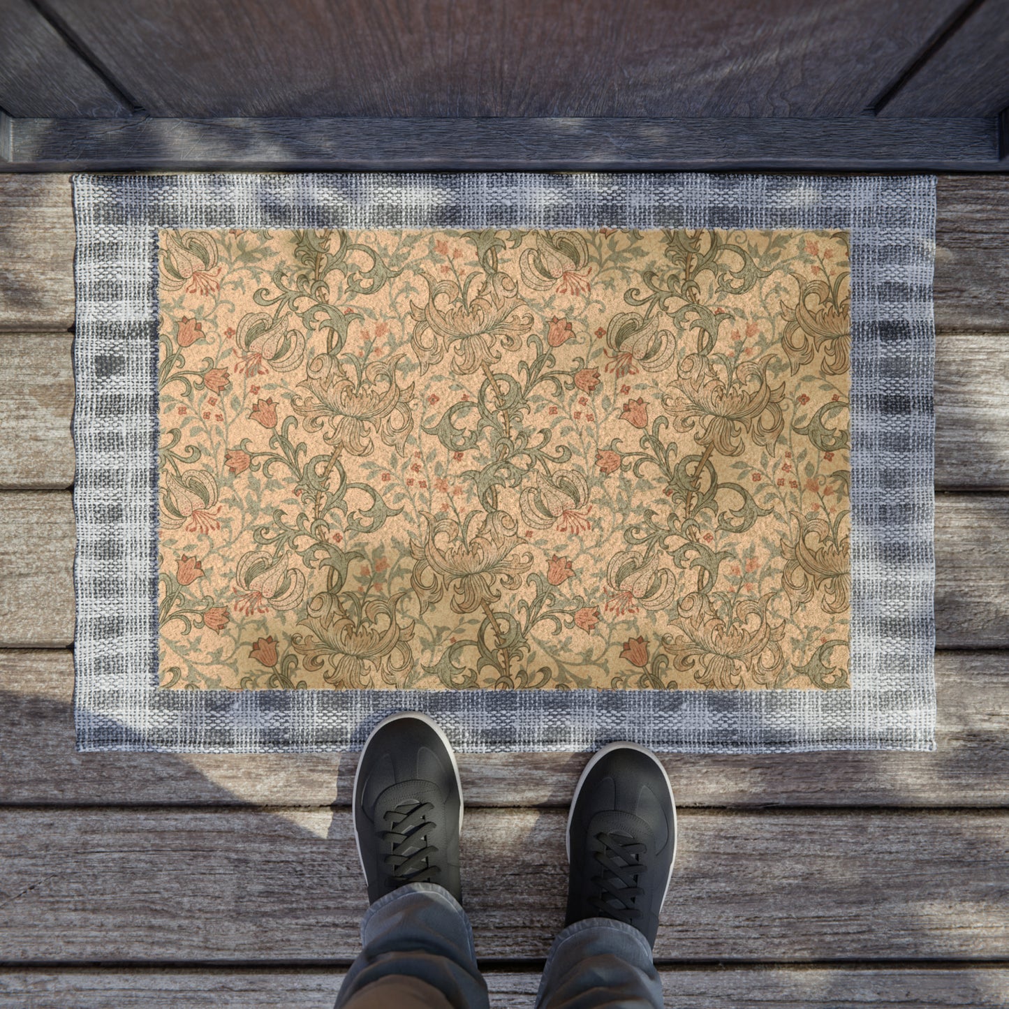 A rectangular coconut coir doormat with an intricate floral and geometric pattern in a mineral colour, inspired by William Morris design.