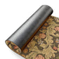 A rectangular coconut coir doormat with an intricate floral William Morris & Co pattern in green and brown colours, featuring a black vinyl backing.