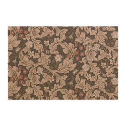 A rectangular coconut coir doormat with a floral William Morris & Co pattern in shades of brown and black.