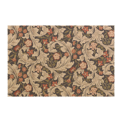A rectangular coconut coir doormat with a floral pattern inspired by William Morris, featuring a mix of brown, beige, and green colours.