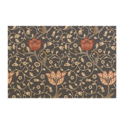 A rectangular coconut coir doormat with an intricate floral William Morris & Co pattern design, featuring a combination of dark and lighter shades, and a visible brush border at the top.