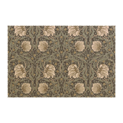 A rectangular doormat with a William Morris & Co floral pattern in shades of blue and beige, featuring tufted coir coconut fibre.