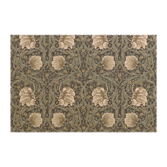A rectangular doormat with a William Morris & Co floral pattern in shades of blue and beige, featuring tufted coir coconut fibre.