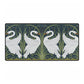 A rectangular desk mat with a floral and swan William Morris & Co pattern design, featuring a white background and swans, placed under a white mouse pad with a keyboard on top.