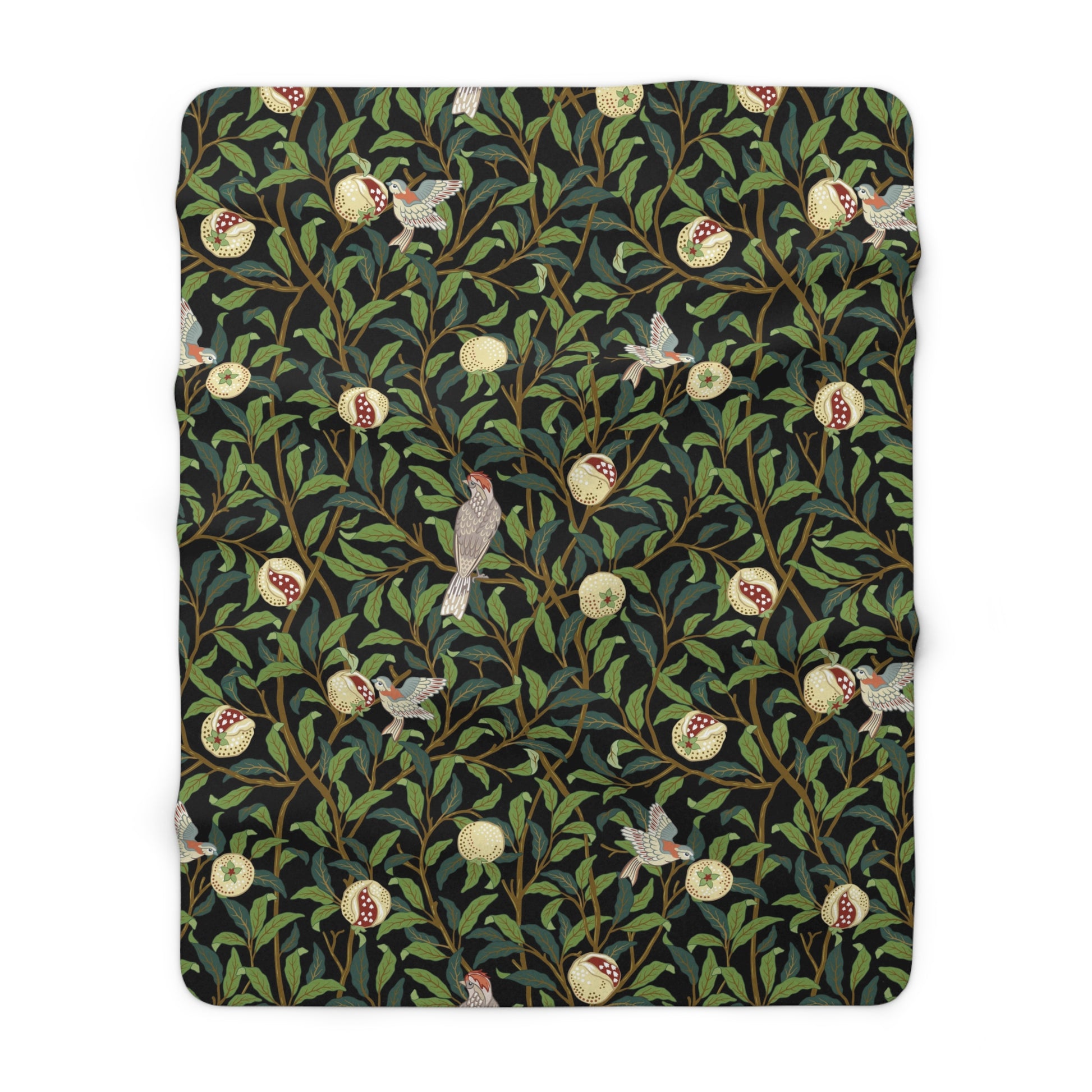 A Sherpa fleece blanket with a floral William Morris & Co pattern featuring birds and pomegranates, predominantly in green tones.