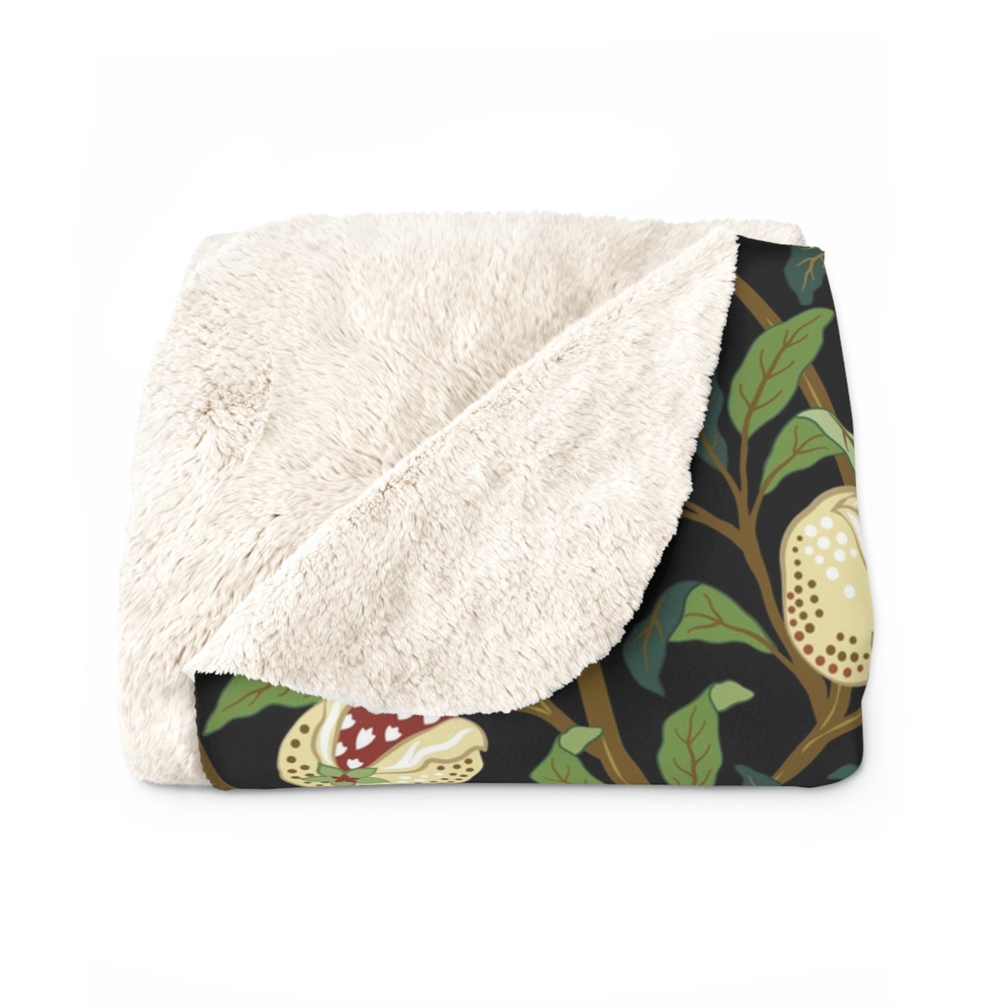 A Sherpa fleece blanket with a floral William Morris & Co pattern featuring birds and pomegranates, predominantly in green tones.
