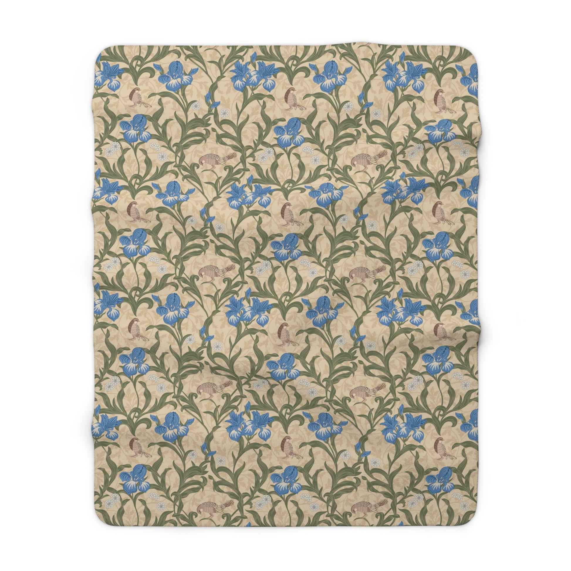A Sherpa fleece blanket with a floral William Morris & Co pattern in blue and green on a beige background.