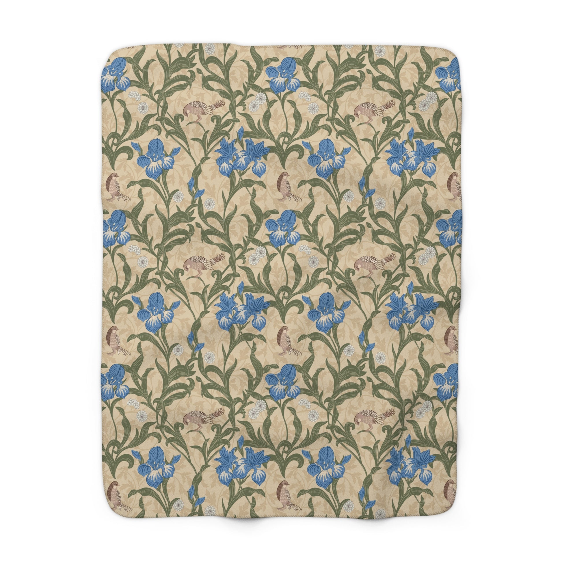 A Sherpa fleece blanket with a floral pattern in blue and green on a beige background.