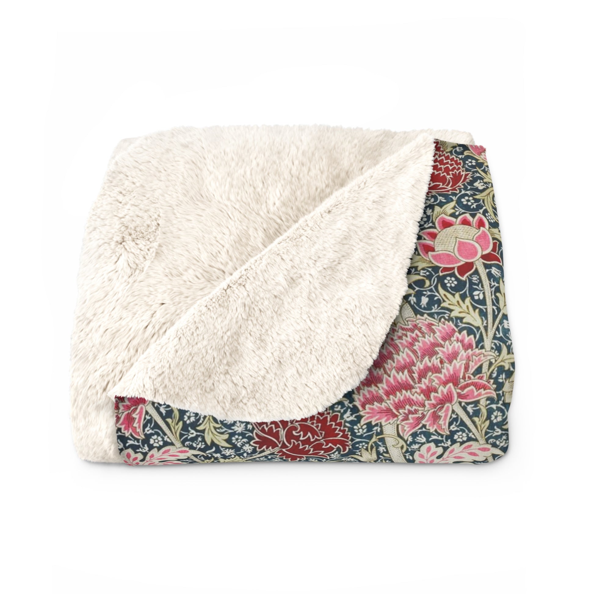 A cozy fluffy fleece blanket with a floral pattern in various colors, laid flat.