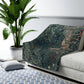 A Sherpa fleece blanket with an intricate floral and tree design, primarily in green and red tones, reflecting a natural and rustic theme.