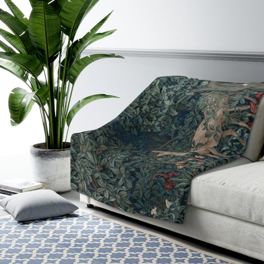 A Sherpa fleece blanket with an intricate floral and tree design, primarily in green and red tones, reflecting a natural and rustic theme.