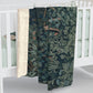 A Sherpa fleece blanket with an intricate floral and tree design, primarily in green and red tones, reflecting a natural and rustic theme.