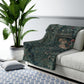 A Sherpa fleece blanket with an embroidered design featuring greenery and a fox, inspired by the William Morris - Greenery Collection.