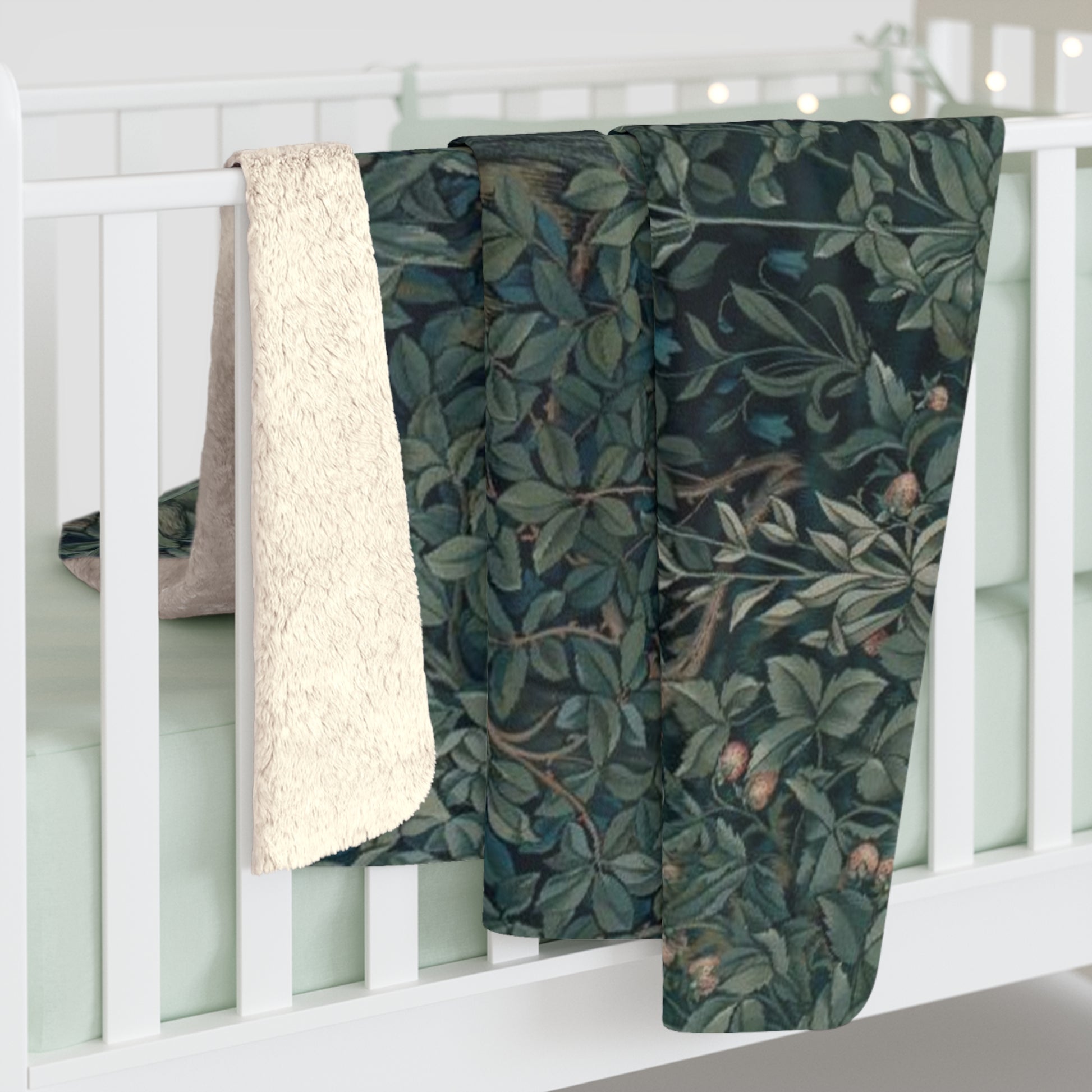 A Sherpa fleece blanket with an embroidered design featuring greenery and a fox, inspired by the William Morris - Greenery Collection.