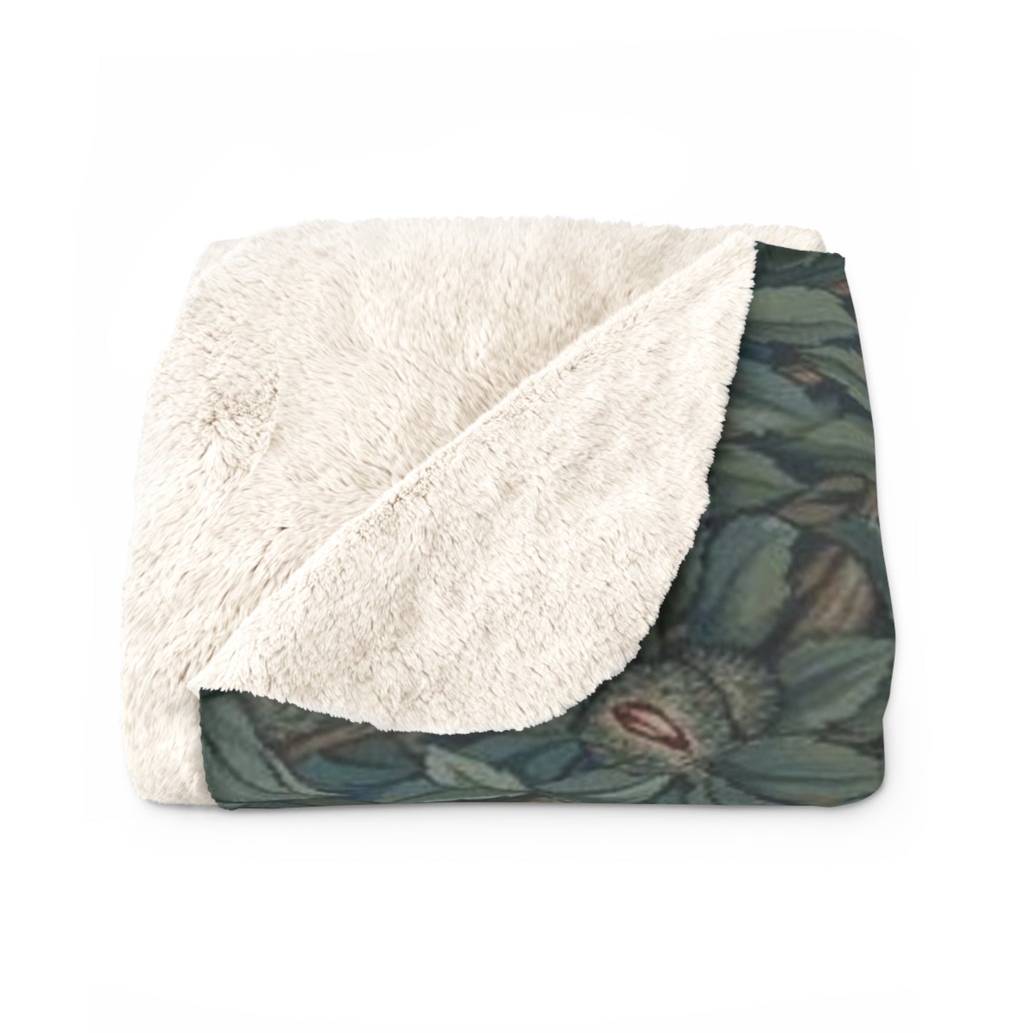 A Sherpa fleece blanket with an embossed design featuring rabbits, foxes, and green foliage on a green background.