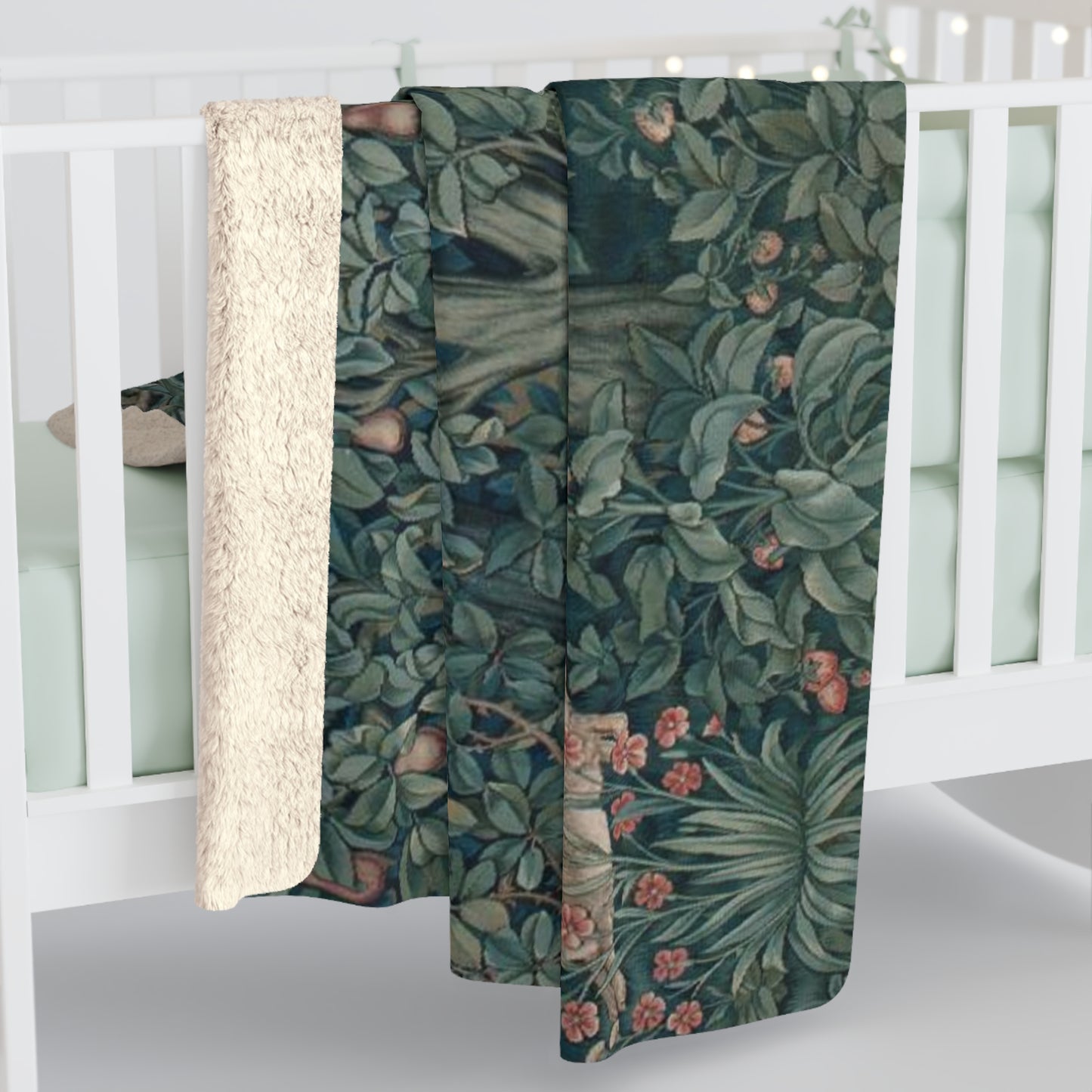 A Sherpa fleece blanket with an embossed design featuring rabbits, foxes, and green foliage on a green background.