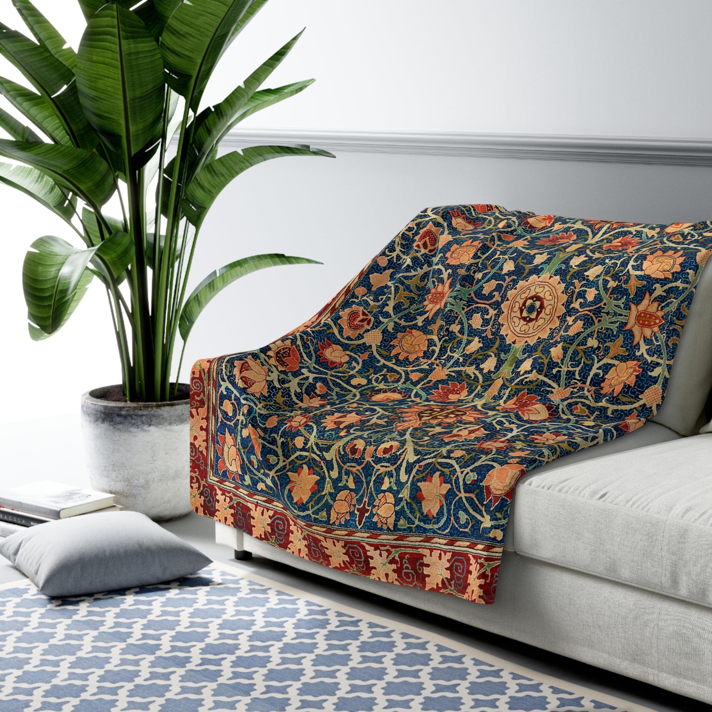 A Sherpa fleece blanket with a geometric and floral pattern in a multicolour William Morris & Co print.