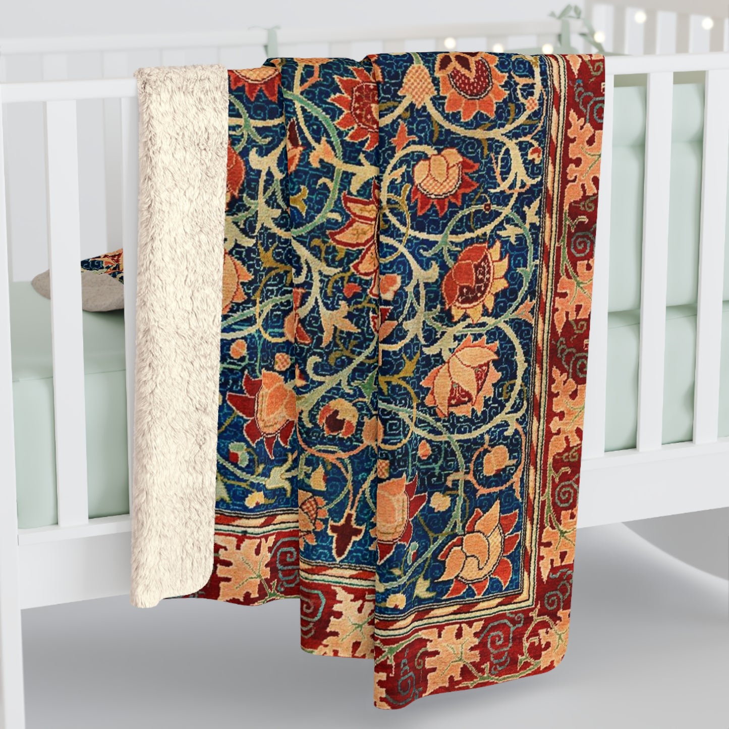 A Sherpa fleece blanket with a geometric and floral pattern in a multicolour William Morris & Co print.