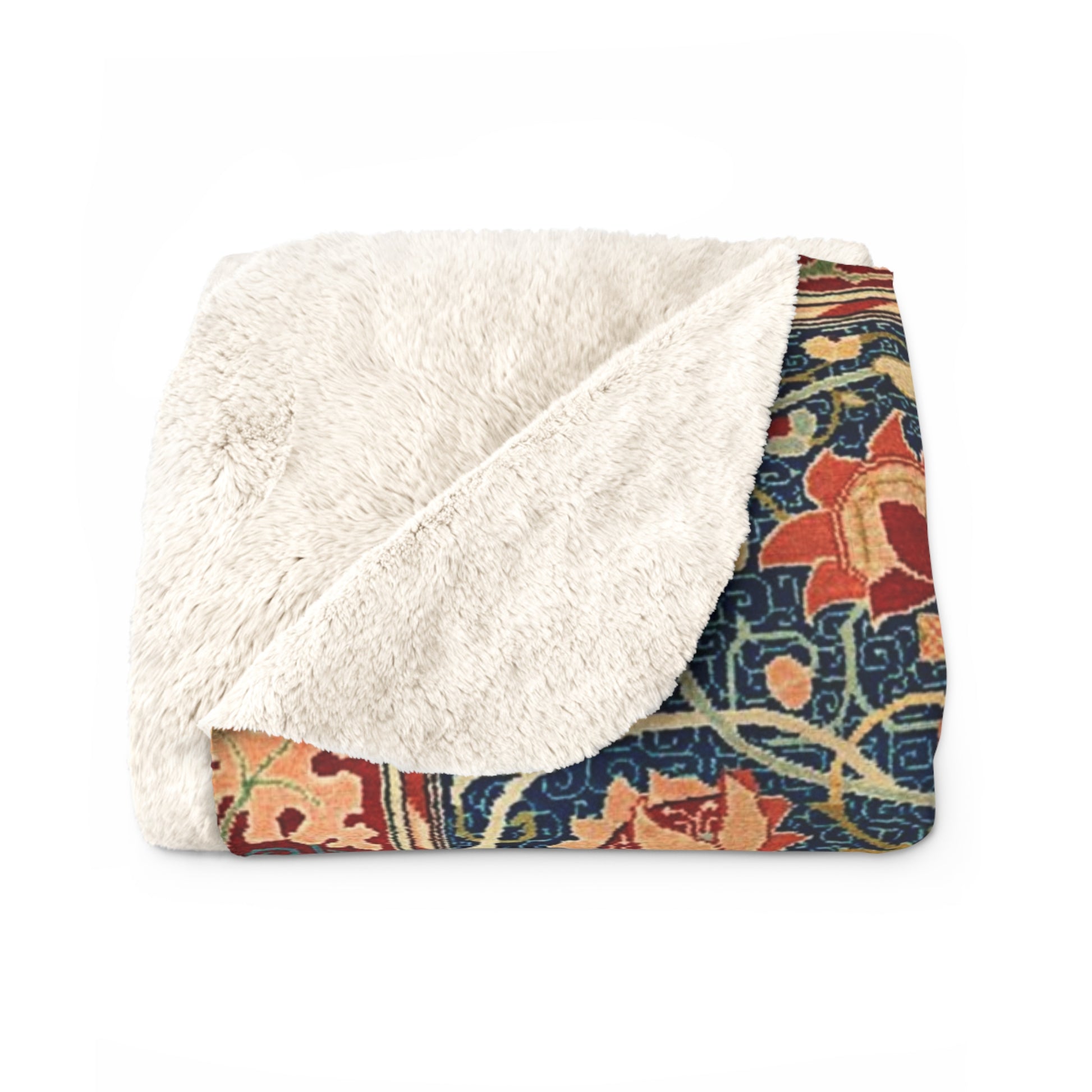 A Sherpa fleece blanket with a geometric and floral pattern in a multicolour William Morris & Co print.