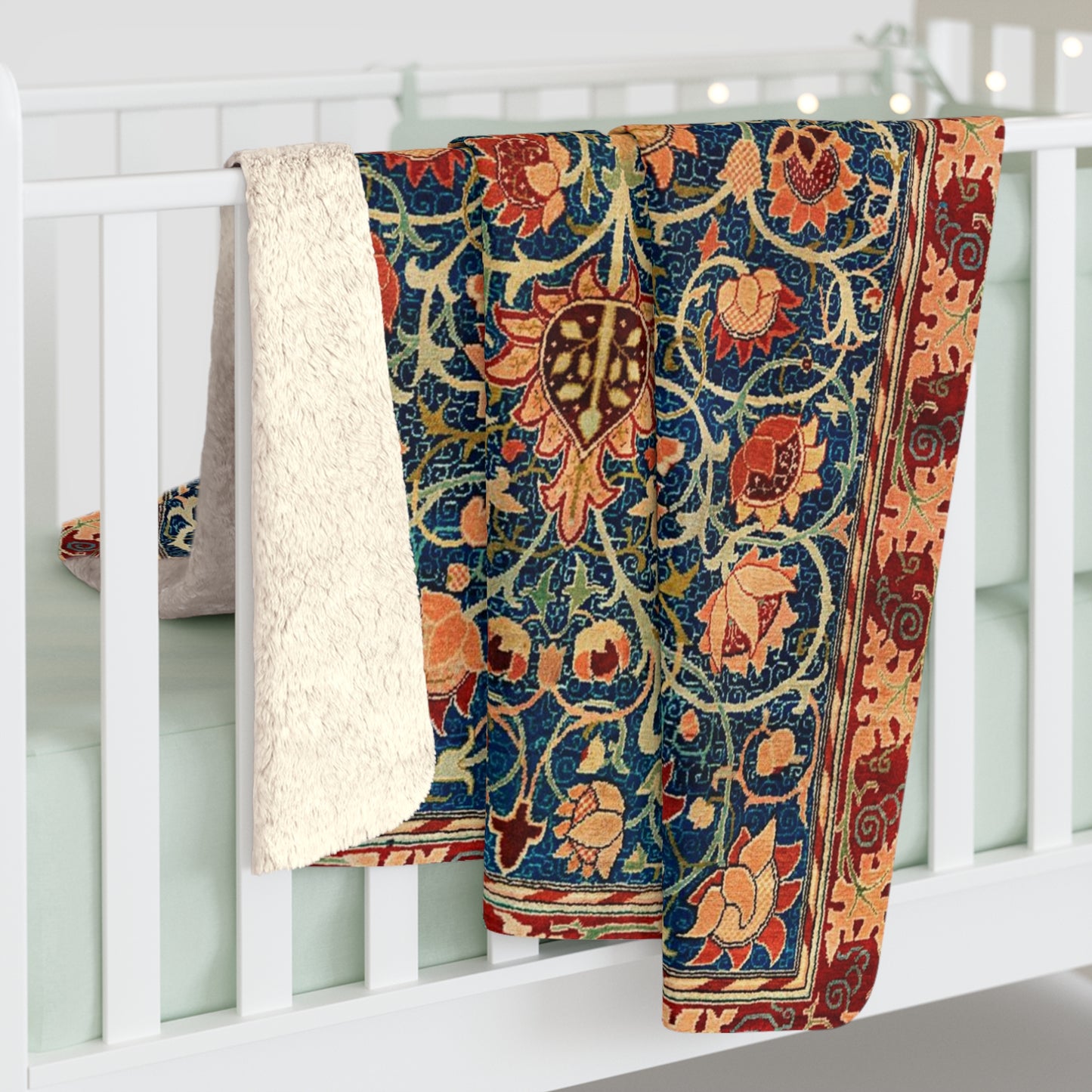 A Sherpa fleece blanket with a geometric and floral pattern in a multicolour William Morris & Co print.