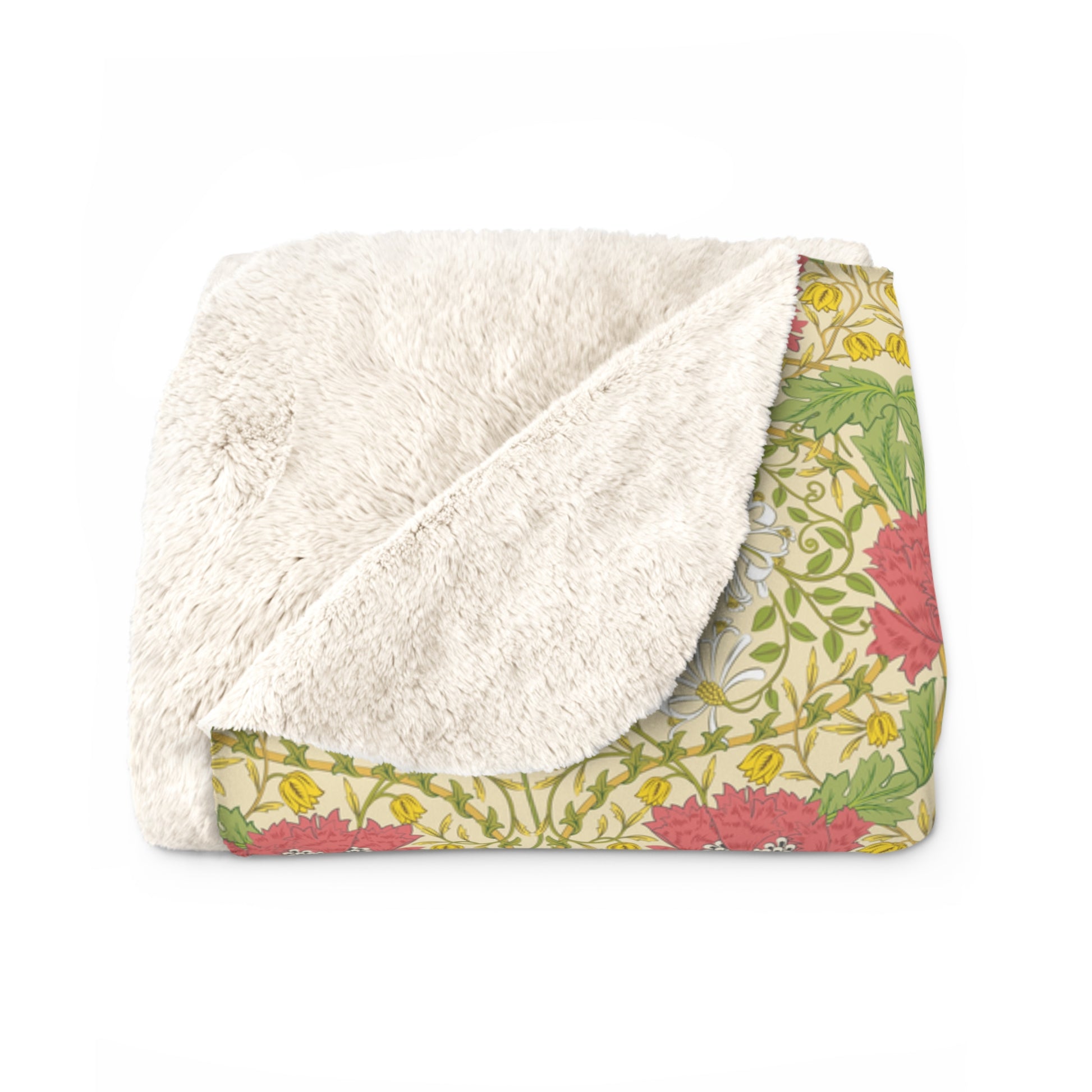 A Sherpa fleece blanket with a floral pattern in pink and yellow hues on a green background, displayed flat.