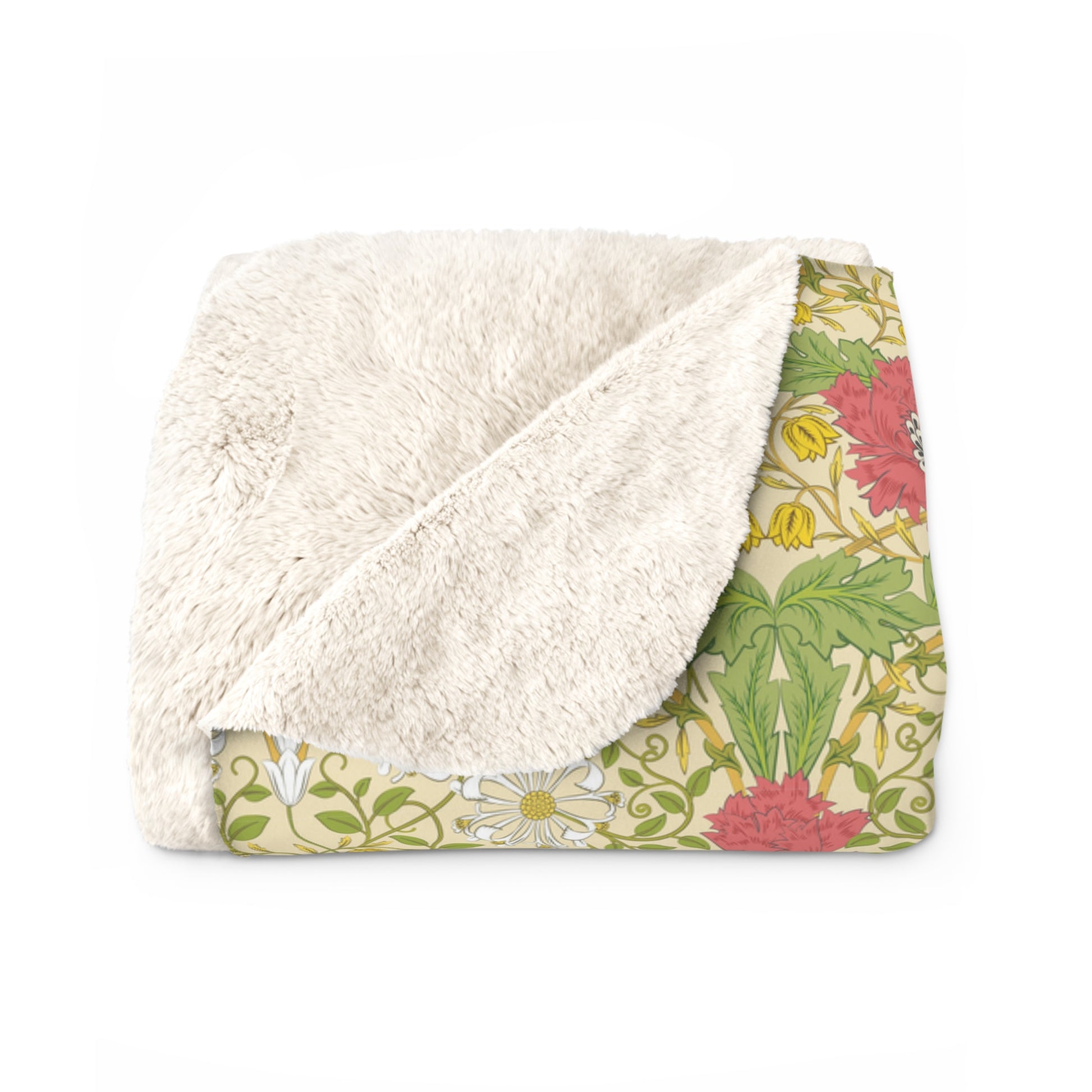 A Sherpa fleece blanket with a floral pattern in pink and yellow hues on a green background, displayed flat.