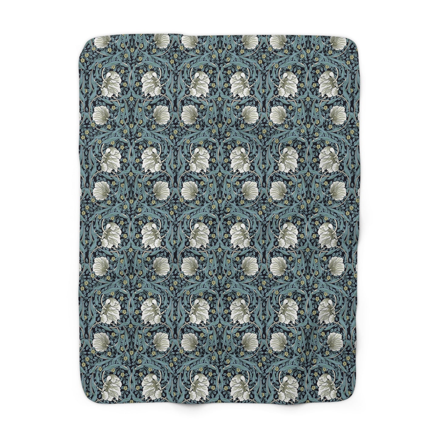 A plush fleece blanket with a geometric William Morris & Co pattern in a slate blue colour, featuring a dense, cozy texture.