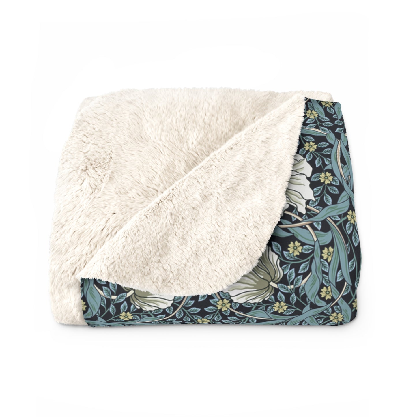 A plush fleece blanket with a geometric William Morris & Co pattern in a slate blue colour, featuring a dense, cozy texture.